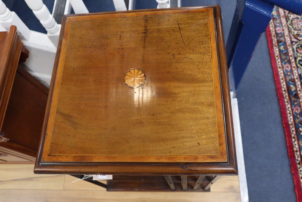 An Edwardian inlaid mahogany revolving bookcase, width 49cm, depth 49cm, height 77cm